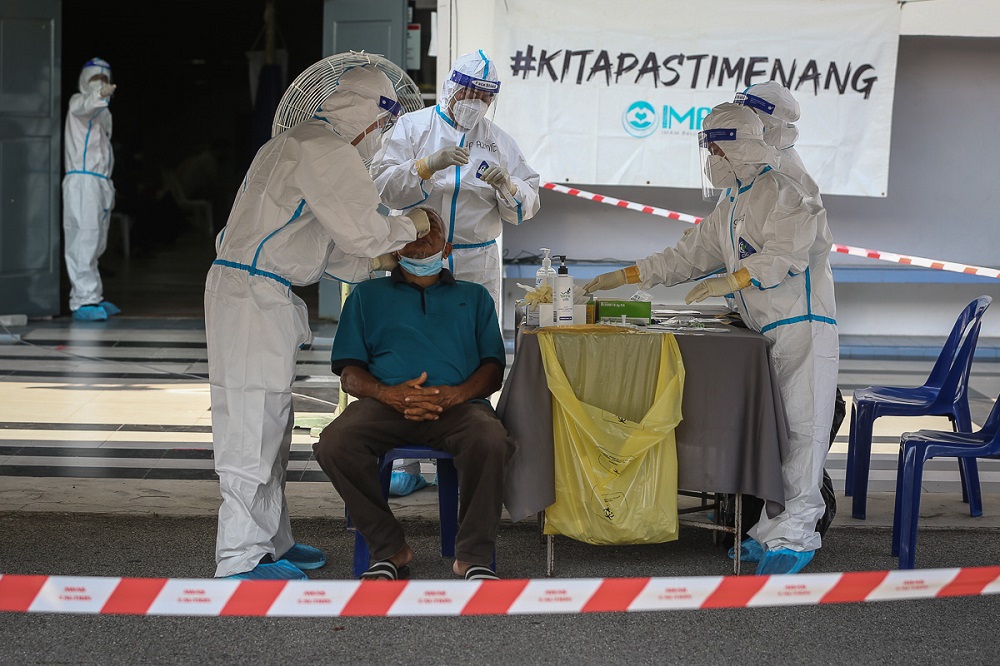 Health workers test members of the public for Covid-19 at Dewan MBSA Seksyen 19 in Shah Alam February 17, 2021. u00e2u20acu201d Picture by Yusof Mat Isa
