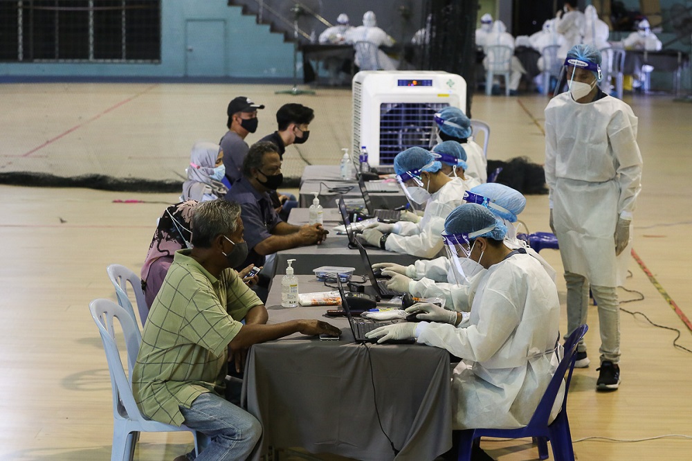 Members of the public register to get tested for Covid-19 at Dewan MBSA Seksyen 19 in Shah Alam February 17, 2021. u00e2u20acu201d Picture by Yusof Mat Isa