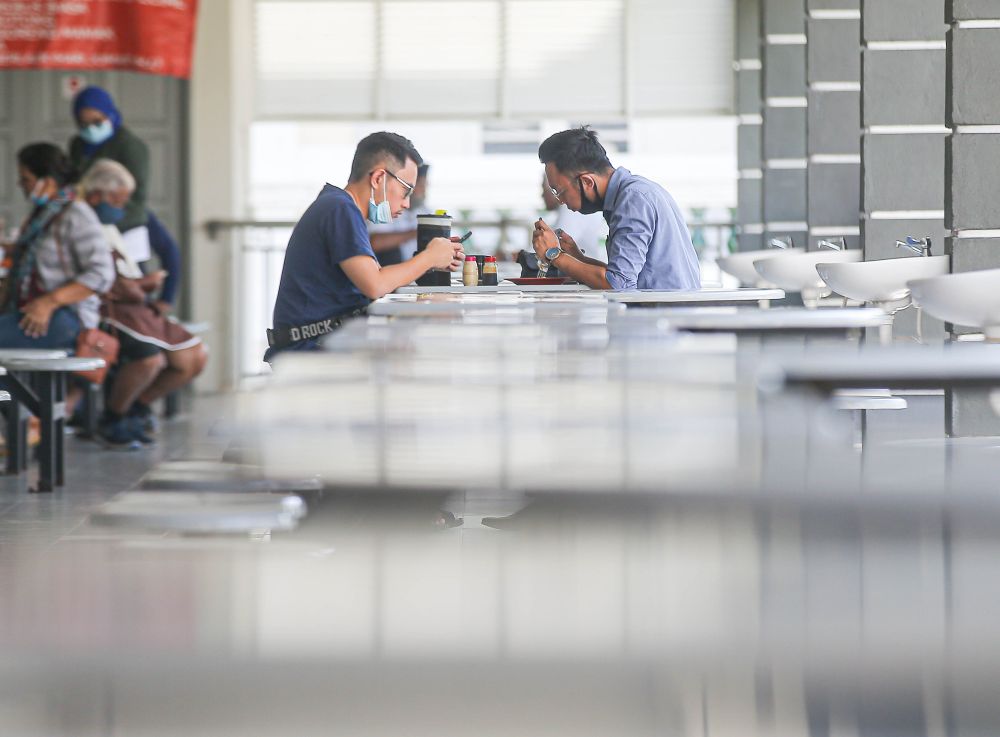 Patrons are pictured dining-in at Medan Selera Dato Sagor in Ipoh February 10, 2021. — Picture by Farhan Najib