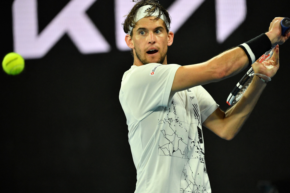 Austriau00e2u20acu2122s Dominic Thiem hits a return against Australiau00e2u20acu2122s Nick Kyrgios during their menu00e2u20acu2122s singles match on day five of the Australian Open tennis tournament in Melbourne February 12, 2021. u00e2u20acu201d AFP picnn