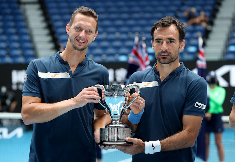 Slovakia's Filip Polasek and Croatia's Ivan Dodig celebrate with the trophy after winning the men's doubles final against Rajeev Ram of the US and Britain's Joe Salisbury, February 19, 2021. u00e2u20acu201d Reuters pic