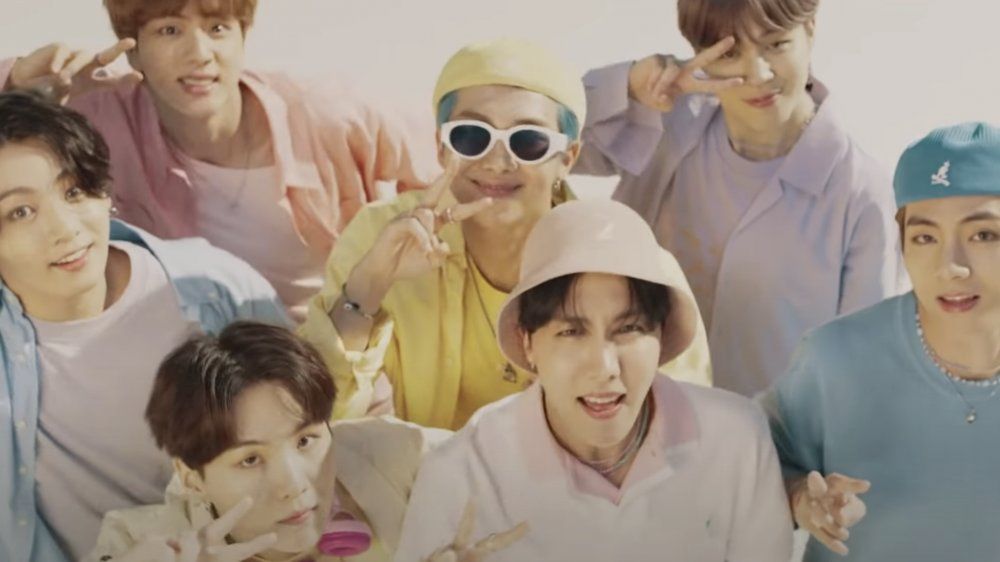 The bright ensembles raked in eight times the amount they were estimated to bring in at the auction. u00e2u20acu201d Screengrab via YouTube/Big Hit Labels