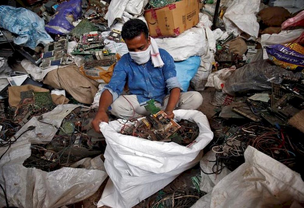 File picture shows a scrap dealer sorting dismantled TV circuit boards at a scrap yard in Ahmedabad, India, July 2, 2020. u00e2u20acu201d Reuters pic
