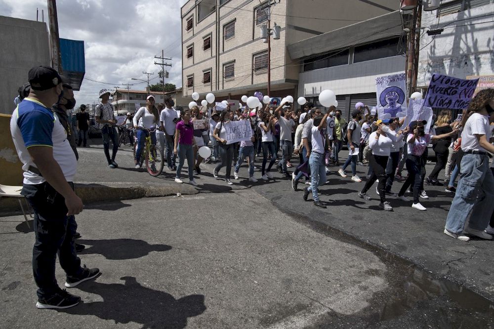 People participate in a protest march in Acarigua, Venezuela, on February 27, 2021, demanding security and justice just days after three young women were murdered in different places in the state of Portuguesa. u00e2u20acu201d AFP pic