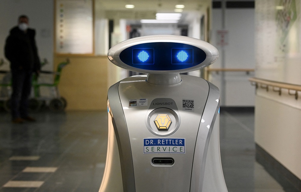Cleaning robot 'Franzi' cleans in the entrance area of a hospital in Munich Neuperlach, southern Germany. u00e2u20acu2022 AFP pic via ETX Studio