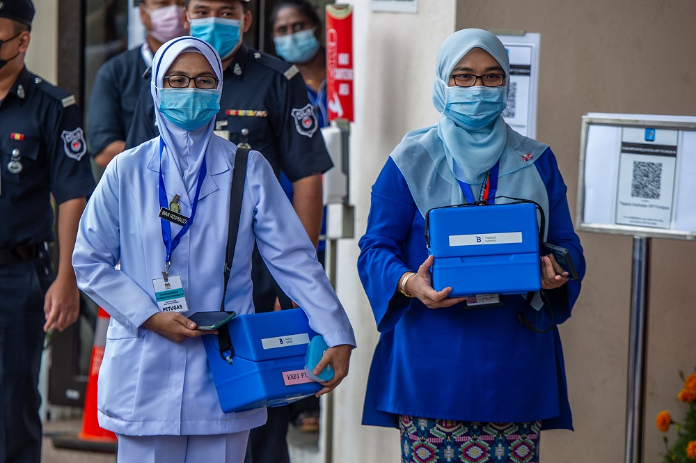 Nurses are seen with the vaccine for the National Covid-19 Immunisation programme launch in Putrajaya February 24, 2021. u00e2u20acu2022 Picture by Shafwan Zaidon