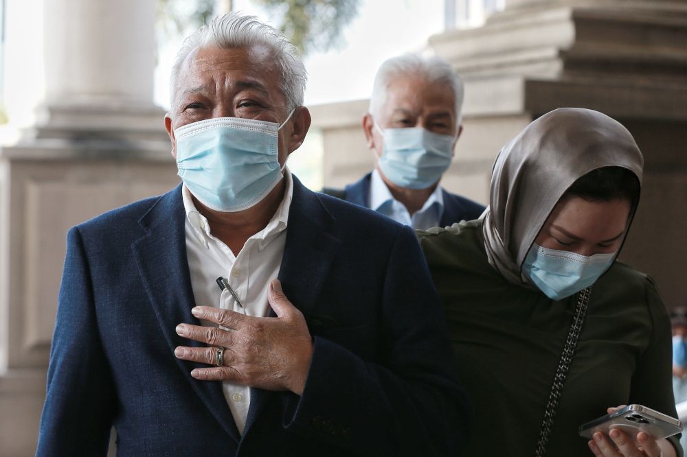 Datuk Seri Bung Moktar Radin and wife Datin Seri Zizie Izette A. Samad (right) arrive at the Kuala Lumpur Courts Complex February 23, 2021. u00e2u20acu201d Picture by Ahmad Zamzahurinn