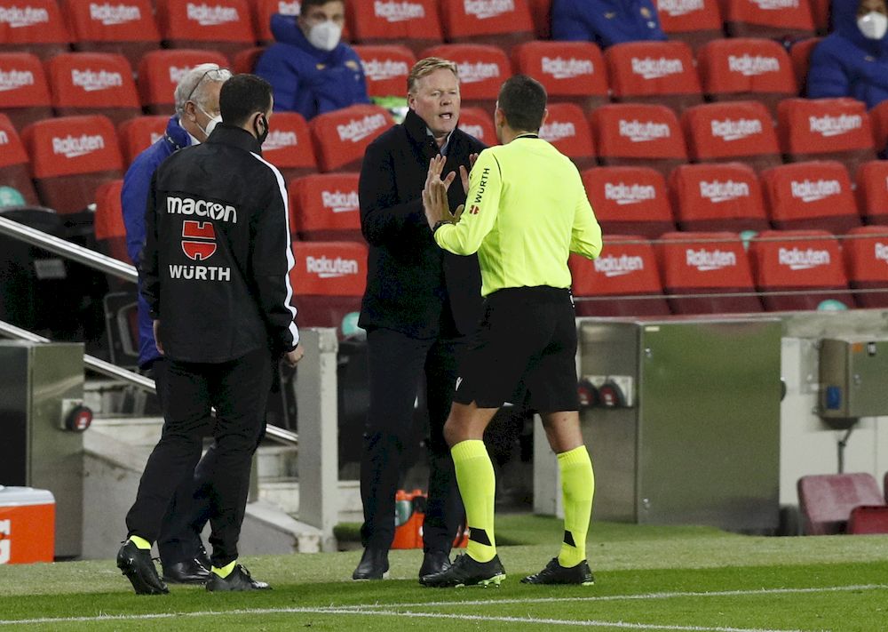 Barcelona coach Ronald Koeman argues with referee Juan Vazquez after a VAR decision disallowed a Barcelona goal against Alaves during the La Liga match Camp Nou, Barcelona, February 13, 2021. u00e2u20acu201d Reuters pic