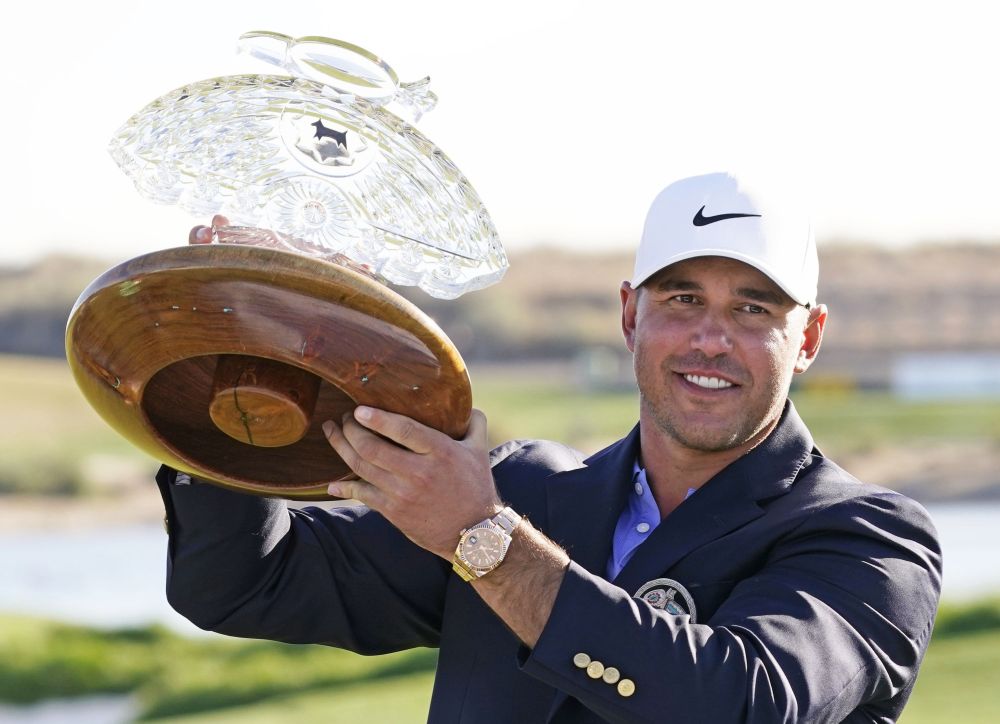 Brooks Koepka poses with the trophy after winning the Waste Management Phoenix Open at TPC Scottsdale, Arizona February 7, 2021. u00e2u20acu201d Reuters picnn