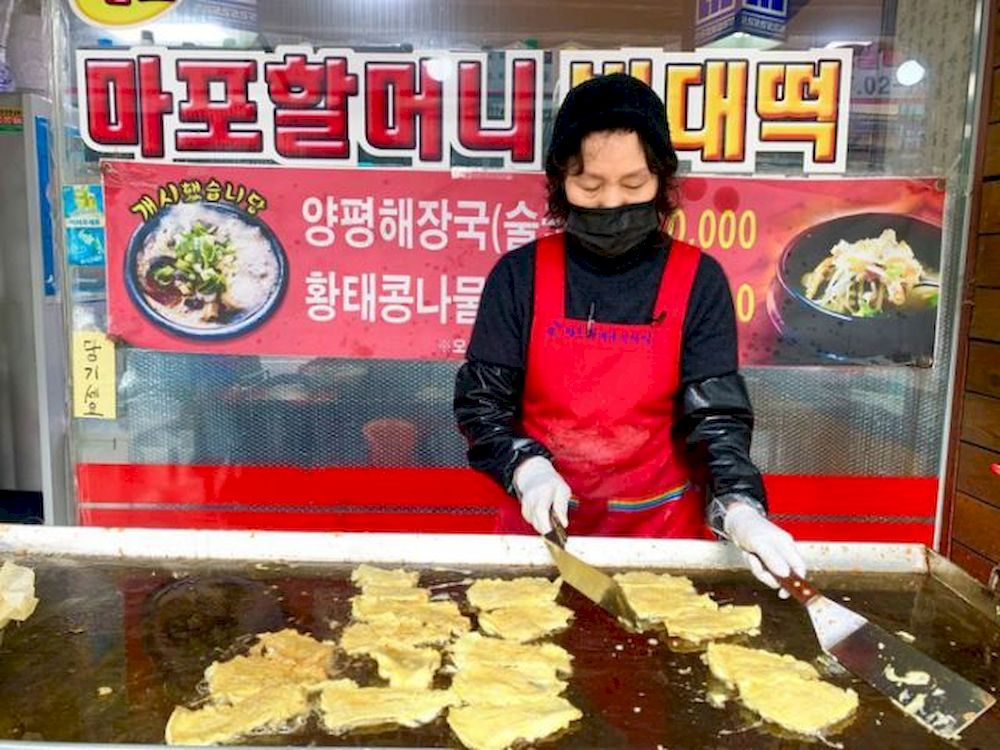 Lee Soon-ai, owner of a Korean traditional pancake house for over 15 years, makes pancakes for the Lunar New Year holidays, in Seoul, South Korea February 11, 2021. u00e2u20acu201d Reuters pic