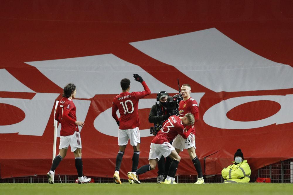 Manchester United's Scott McTominay celebrates scoring their first goal against West Ham with teammates at Old Trafford, Manchester February 9, 2021. u00e2u20acu201d Reuters pic