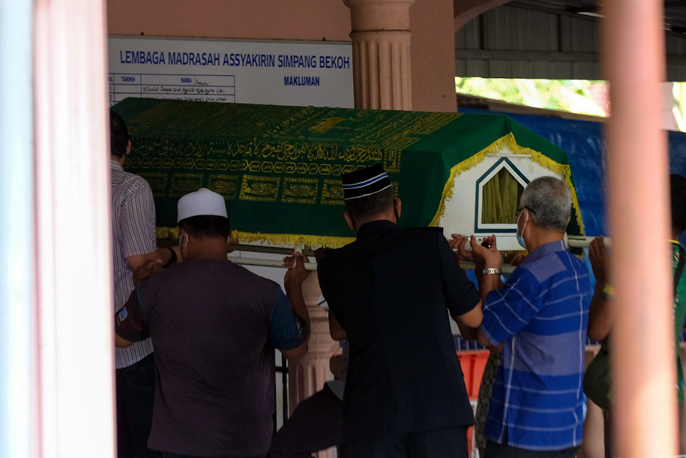 The boyu00e2u20acu2122s remains at Surau Madrasah As Syakirin before being laid to rest at the Padang Lebar Muslim Cemetery, Simpang Bekoh, Jasin, February 1, 2021. u00e2u20acu201d Bernama picn