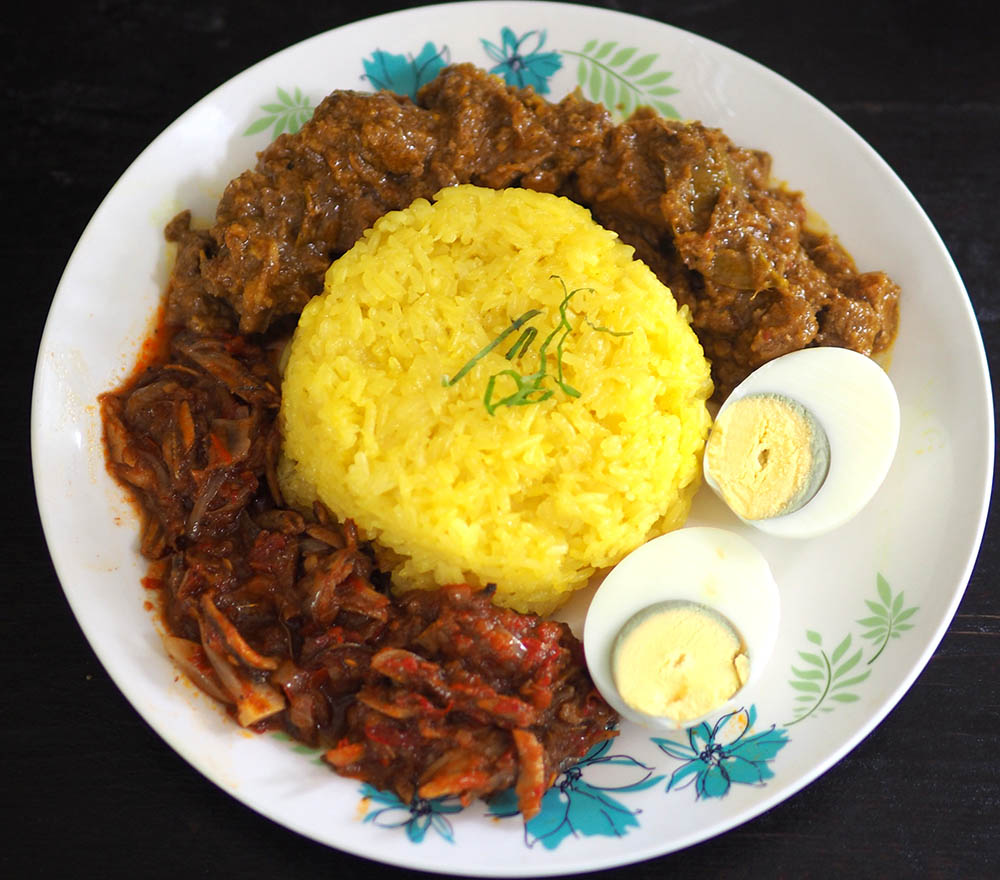 Celebrate with this golden 'pulut kuning' served with 'rendang', 'sambal tumis' and hard boiled egg.