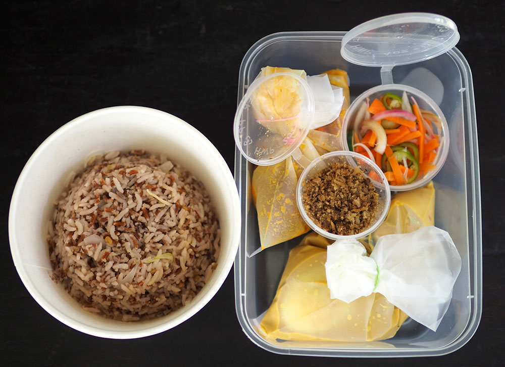 Each element of the 'nasi dagang' is packed separately so just assemble it for your lunch.