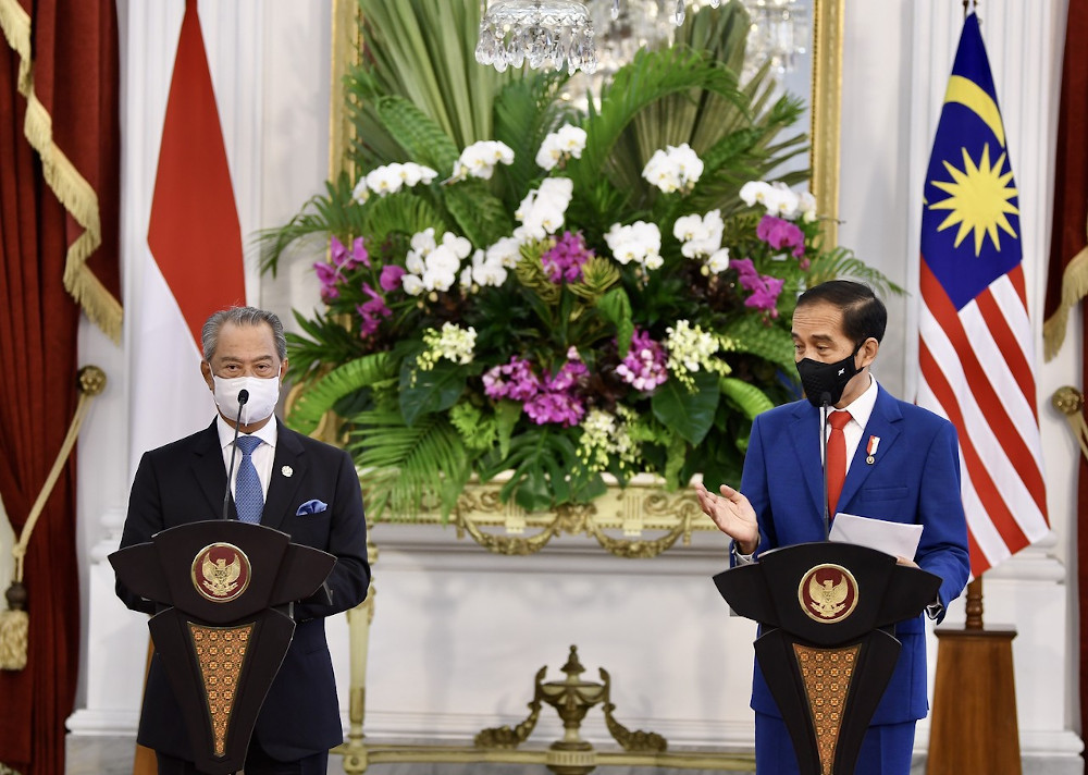 Prime Minister Tan Sri Muhyiddin Yassin and Indonesian President Joko Widodo at a press conference after their meeting at Istana Merdeka in Jakarta, February 5, 2021. u00e2u20acu201d Bernama pic 