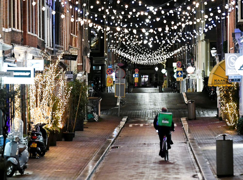 An Uber Eats delivery person rides a bicycle in Amsterdam, Netherlands February 16, 2021. u00e2u20acu201d Reuters picnn
