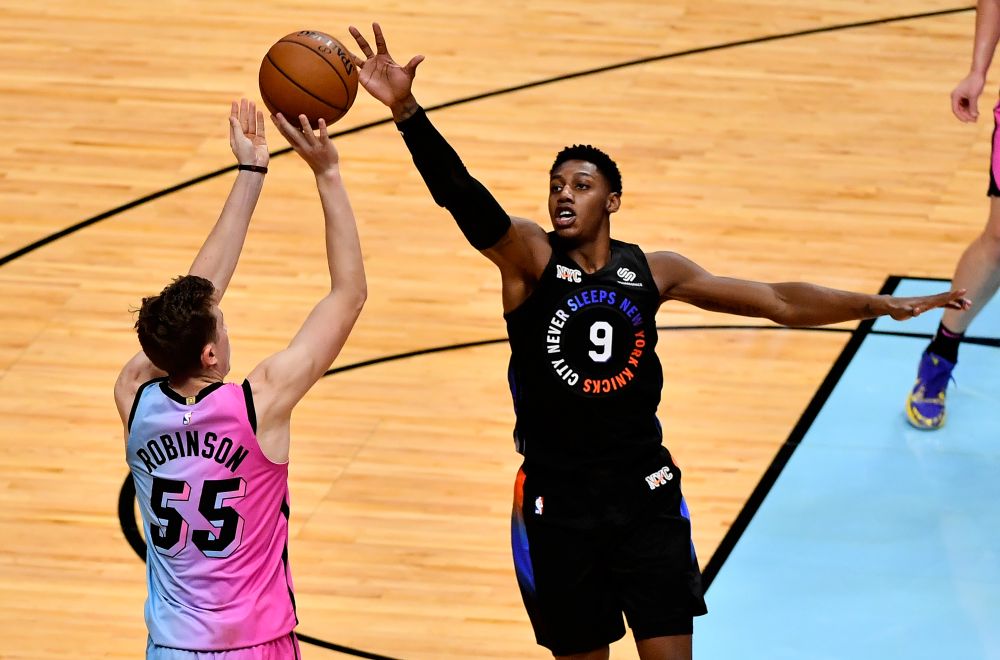 Miami Heat guard Duncan Robinson (55) attempts a three point shot over New York Knicks guard RJ Barrett (9) during the second half at American Airlines Arena February 9, 2021. u00e2u20acu201d Reuters pic