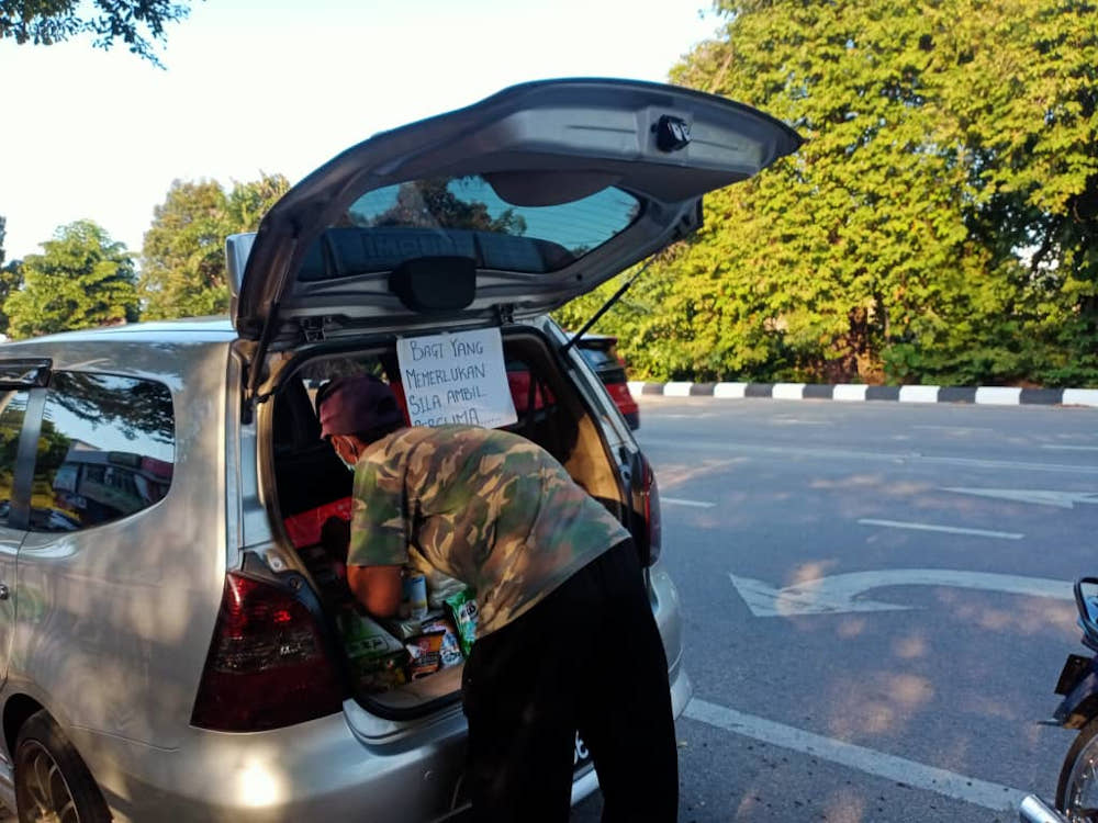 The Seberang Perai City Council employee says items in the car food bank are donated by the public to help those in need. — Picture courtesy of Azizul Rahim