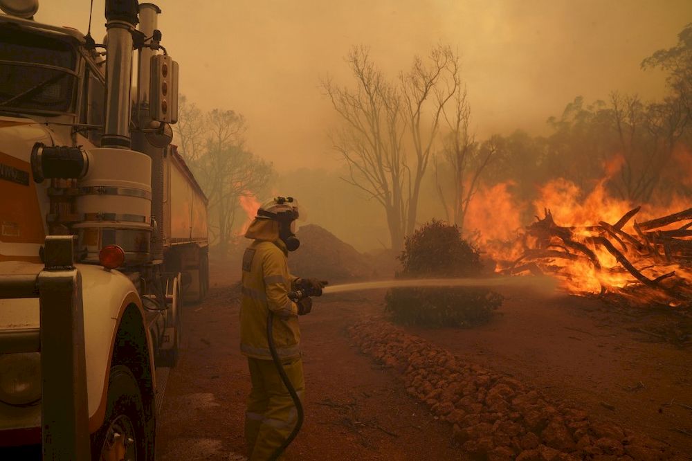 This handout photo taken on February 2, 2021 and released by West Australiau00e2u20acu2122s Department of Fire and Emergency Services (DFES) shows a firefighter fighting a fire outside Wooroloo, near Perth. u00e2u20acu201d AFP pic