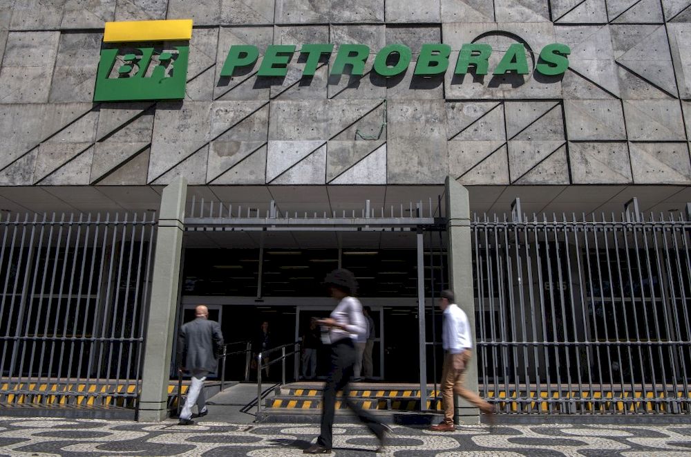 In this file picture, people walk by the headquarters of the Brazilian state-controlled oil company Petrobras in Rio de Janeiro, Brazil. u00e2u20acu201d AFP pic
