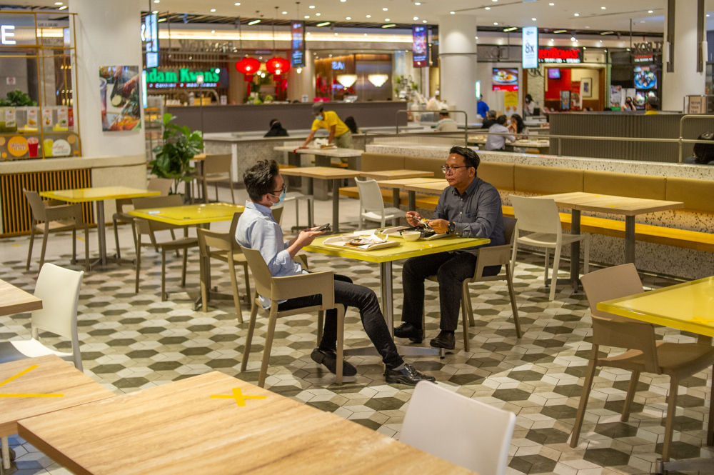 Patrons are seen here having their meals at a mall in Kuala Lumpur during lunch hour. u00e2u20acu201d Picture by Shafwan Zaidon