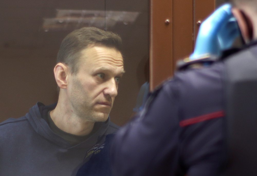 Alexei Navalny, who is accused of slandering a Russian World War Two veteran, stands inside a defendant dock before a court hearing in Moscow February 5, 2021. u00e2u20acu201d Picture by Press Service of Babushkinsky District Court of Moscow via Reuters