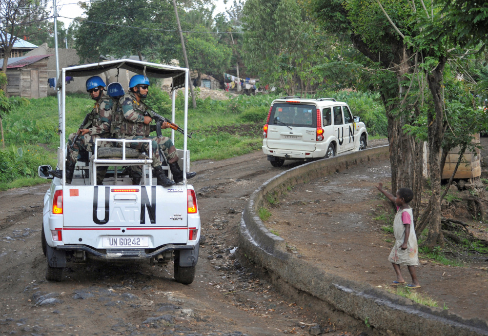 A Congolese girl gestures to peacekeepers from India, serving in the UN Organisation Stabilisation Mission in the Democratic Republic of the Congo (Monusco), as they ride on patrol in Kiwanja October 19, 2018. u00e2u20acu201d Reuters pic