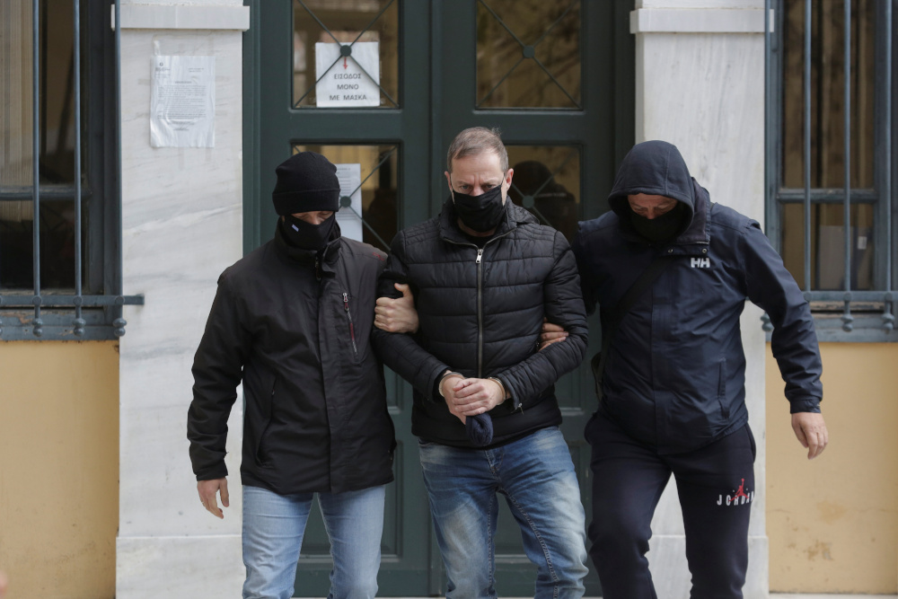 Greek actor and former director of Greeceu00e2u20acu2122s National Theatre Dimitris Lignadis is escorted by plain clothes police officers as he leaves the prosecutoru00e2u20acu2122s office, in Athens February 21, 2021. u00e2u20acu201d Reuters pic