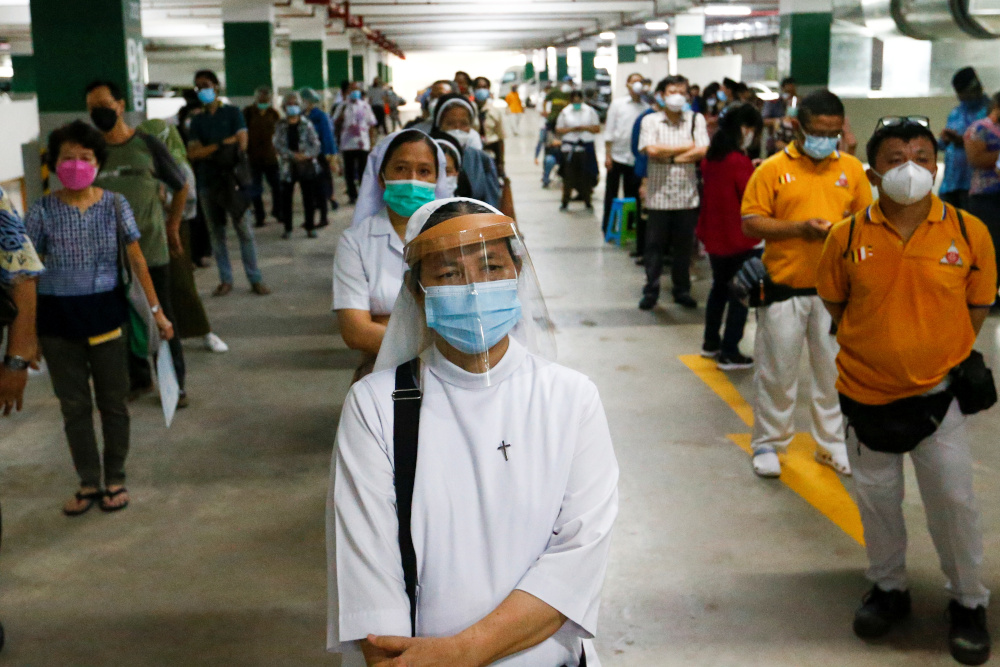 Nuns stand in line while waiting to receive their first dose of Chinau00e2u20acu2122s Sinovac Biotech Covid-19 vaccine during the mass vaccination programme for clergy in Jakarta February 25, 2021. u00e2u20acu201d Reuters pic