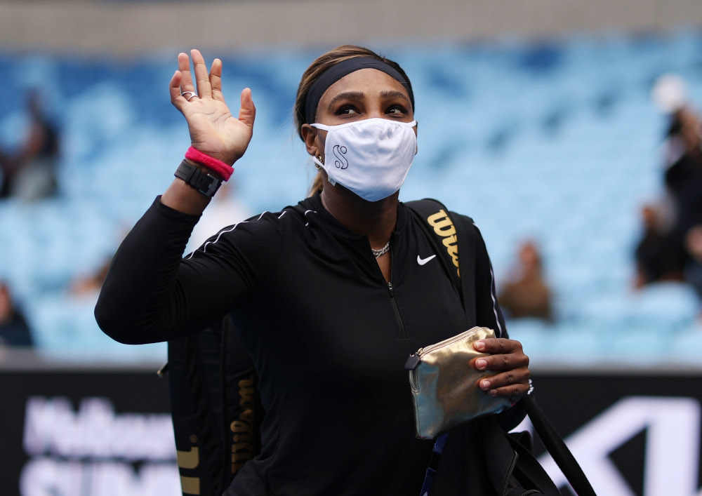 Serena Williams of the US wearing a protective face mask waves as she walks off court after winning her Yarra Valley Classic match against Australiau00e2u20acu2122s Daria Gavrilova at Melbourne Park, Melbourne February 1, 2021. u00e2u20acu201d Reuters pic