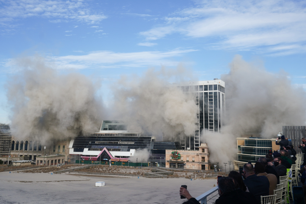 People take pictures as the Trump Plaza Casino collapses after a controlled demolition in Atlantic City, New Jersey February 17, 2021. u00e2u20acu201d Reuters pic