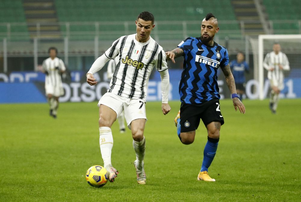 Juventus' Cristiano Ronaldo in action with Inter Milan's Arturo Vidal during the Coppa Italia semi-final at the San Siro, Milan February 2, 2021. u00e2u20acu201d Reuters pic