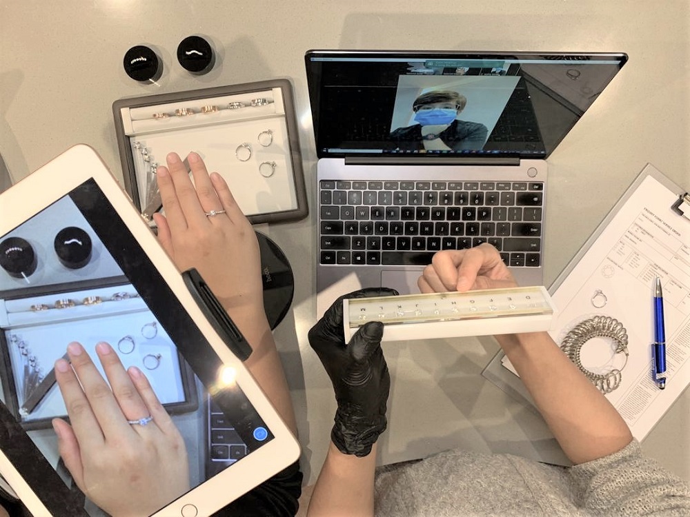 A hand model showcases a selection of rings to a customer during a virtual consultation session. ― Picture courtesy of Tailored Jewel