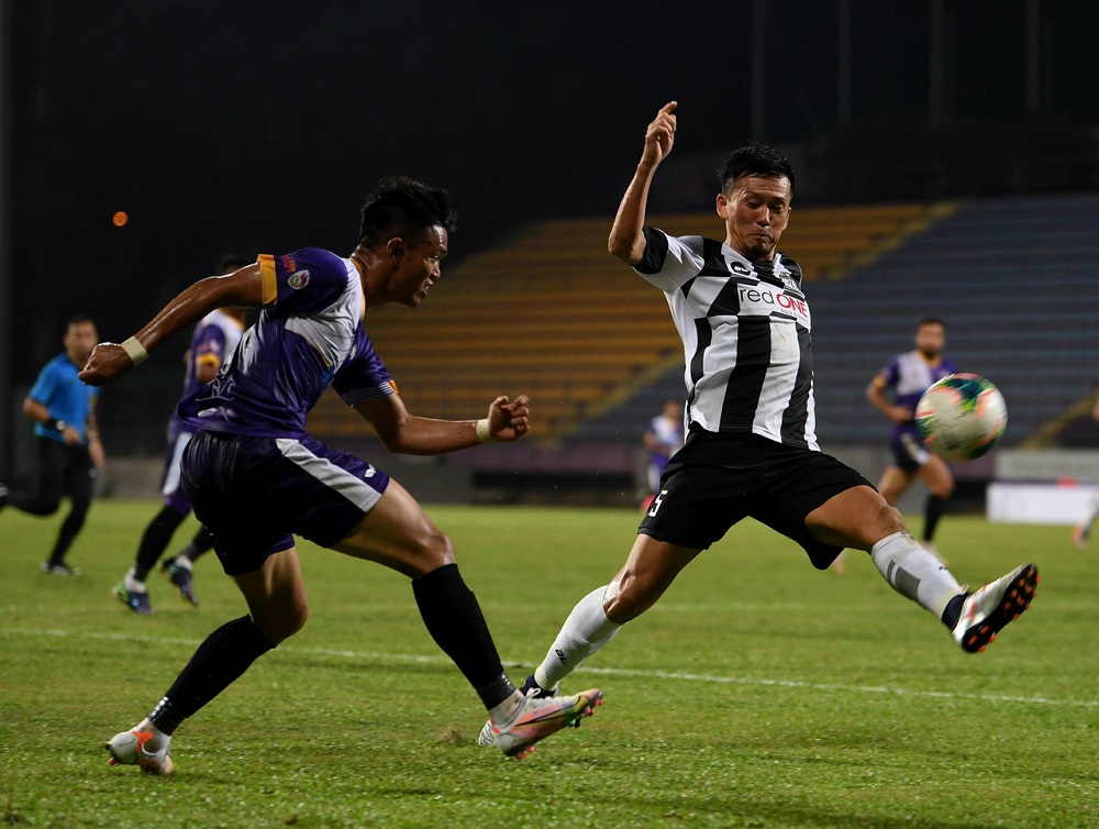 Terengganu FC IIu00e2u20acu2122s Masaki Watanabe (right) in action with UiTM FC Mohamad Khairul Rizam during the Shah Alam City Cup tournament yesterday, February 20, 2021. u00e2u20acu2022 Bernama pic