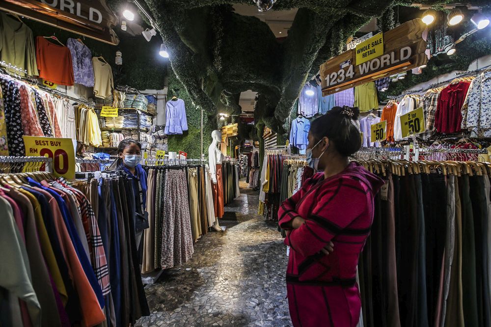 Vendors wait for customers at Berjaya Times Square, Kuala Lumpur February 23, 2021. u00e2u20acu2022 Picture by Hari Anggara