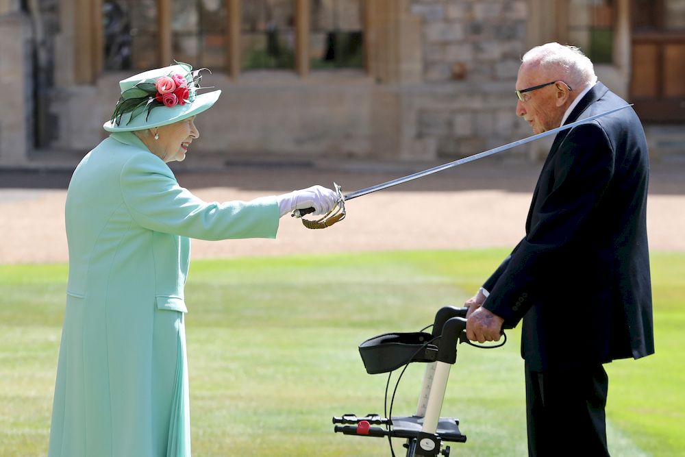 Britainu00e2u20acu2122s Queen Elizabeth awards Captain Tom Moore with the insignia of Knight Bachelor at Windsor Castle, in Windsor, Britain July 17, 2020. u00e2u20acu201d Reuters file pic