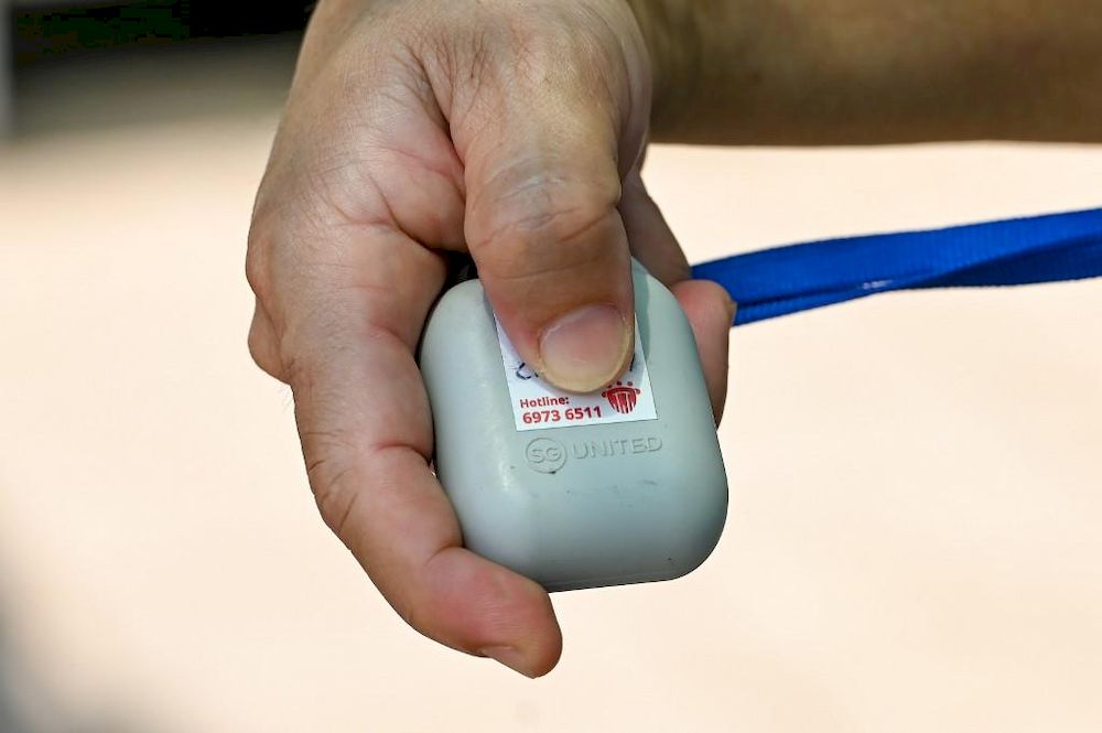 A user displays the TraceTogether token, used for contact tracing to prevent the spread of Covid-19 coronavirus in Singapore. u00e2u20acu201d AFP pic