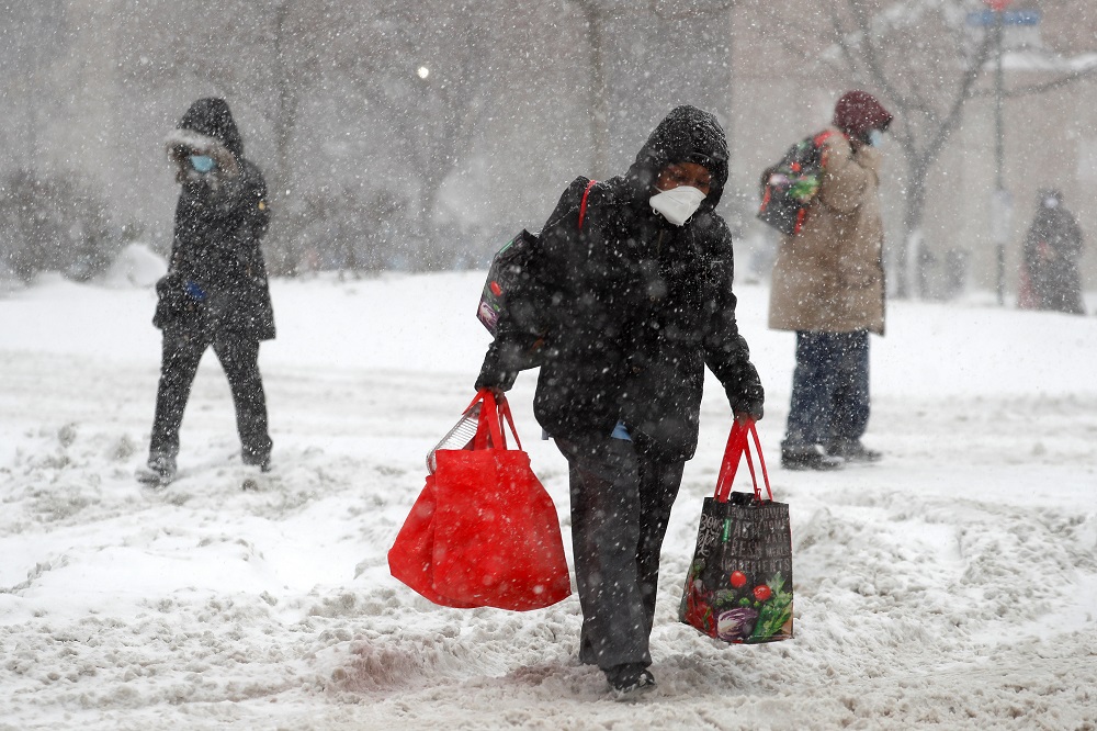 People struggle through heavy falling snow in the Harlem section of Manhattan during a winter storm in New York February 1, 2021. u00e2u20acu2022 Reuters pic