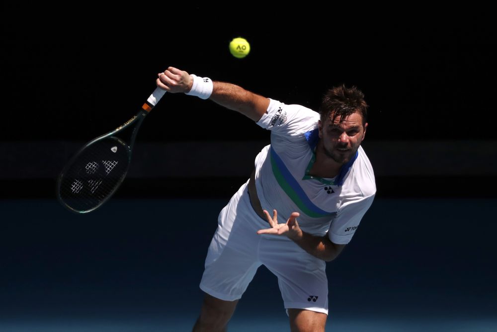Switzerlandu00e2u20acu2122s Stan Wawrinka in action during his second round match against Hungaryu00e2u20acu2122s Marton Fucsovics at Melbourne Park February 10, 2021. u00e2u20acu201d Reuters pic