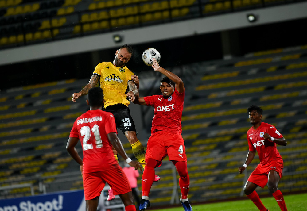 Perak player Guilherme De Paula heads the ball towards the goal during the Super League match against PJ City FC at Stadium Perak, March 7, 2021. u00e2u20acu201d Bernama pic