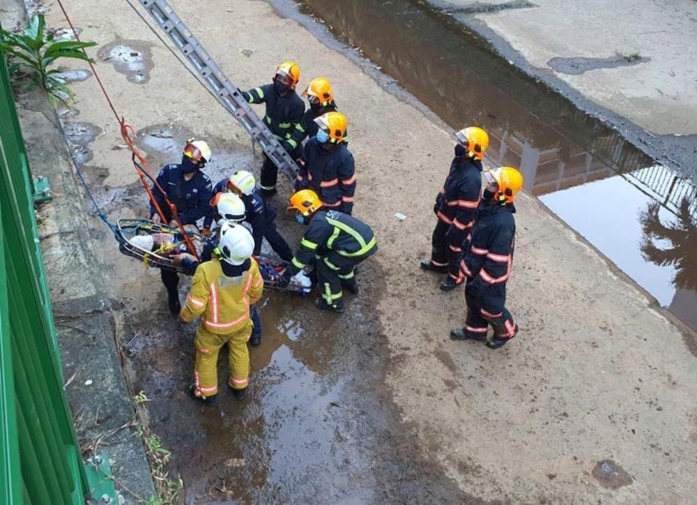 Rescuers seen trying to hoist an injured woman out of a canal. u00e2u20acu201d Picture courtesy of Singapore Civil Defence Force/Facebook