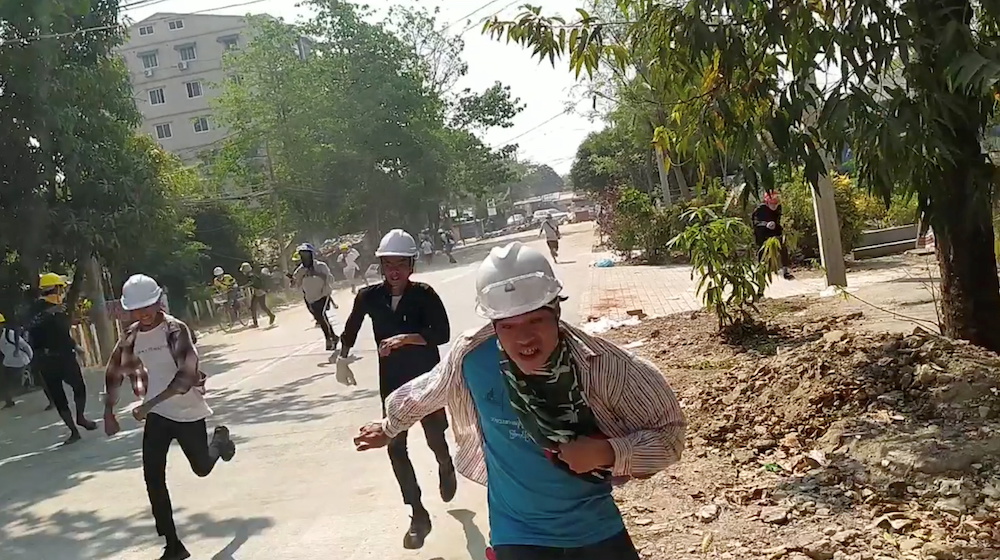 People flee away to safety during a protest in Yangon, Myanmar March 10, 2021 in this still image obtained by Reuters from a social media video. u00e2u20acu201d Reuters pic