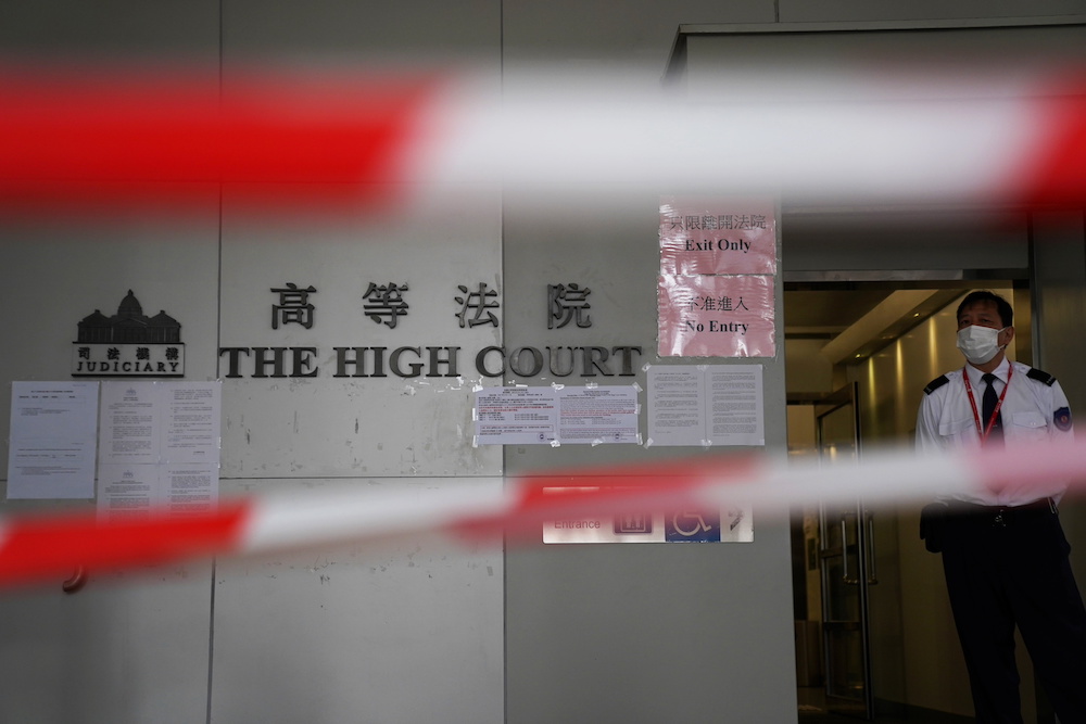 A guard stands behind cordons before a court hearing on the appeal against the bail release of 11 pro-democracy activists charged with national security violations, at the High Court in Hong Kong March 11, 2021. u00e2u20acu201d Reuters pic