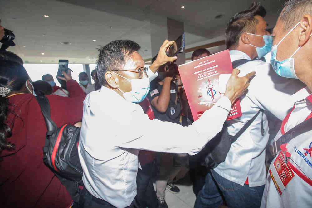 Chaos broke out at the DAP party election today at the Ipoh Convention Centre over alleged unfairness in the registration of delegates, March 14, 2021. — Picture by Farhan Najib