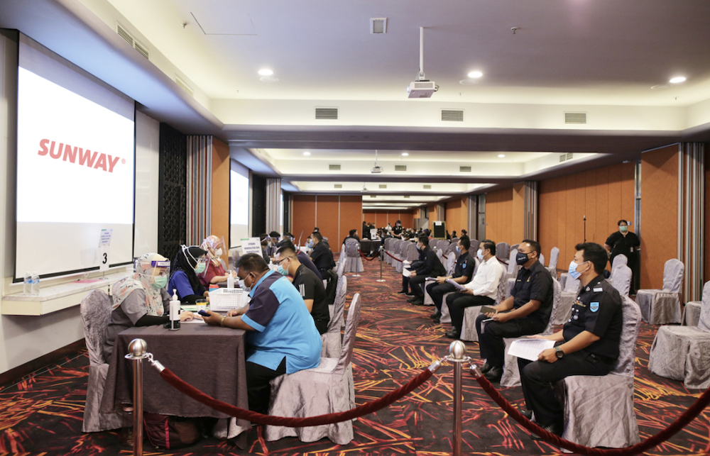 Frontline workers receiving Covid-19 vaccinations at Sunway Pyramid Convention Centre, the first private large-scale vaccination centre for the Petaling district. u00e2u20acu201d Picture courtesy of Sunway Group