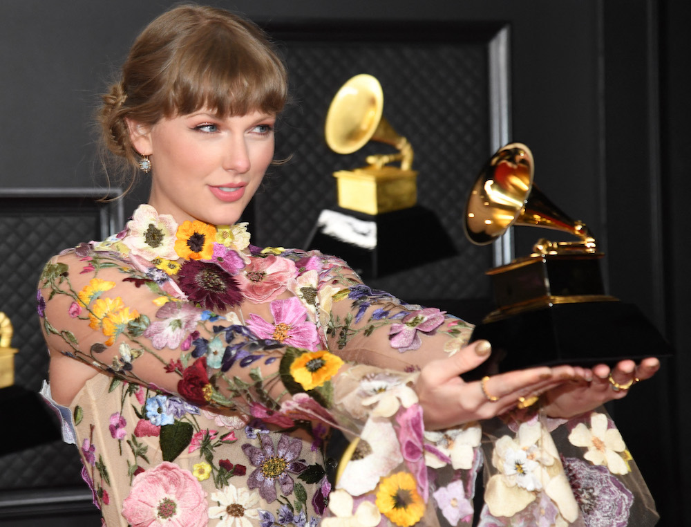 In this handout photo courtesy of The Recording Academy, Taylor Swift, winner of the Album of the Year award for u00e2u20acu02dcFolklore,u00e2u20acu2122 poses in the media room during the 63rd Annual Grammy Awards in Los Angeles March 15, 2021. u00e2u20acu201d Handout via AFP