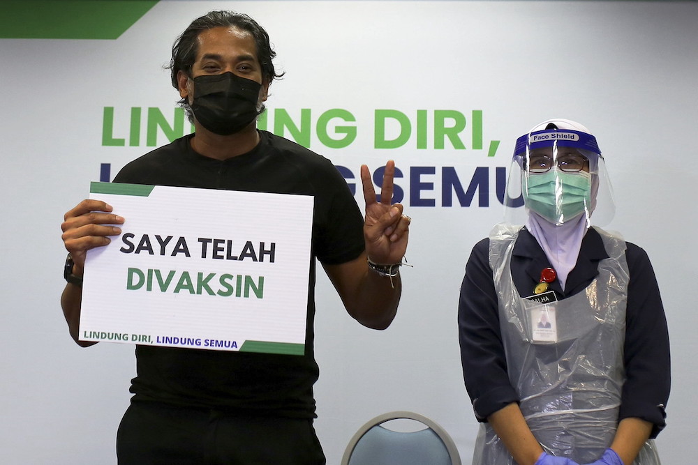 National Covid-19 Immunisation Programme Coordinating Minister Khairy Jamaluddin shows a placard u00e2u20acu02dcI Have Been Vaccinedu00e2u20acu2122 after receiving the Sinovac Covid-19 vaccine at Rembau Hospital, March 18, 2021. u00e2u20acu201d Bernama pic