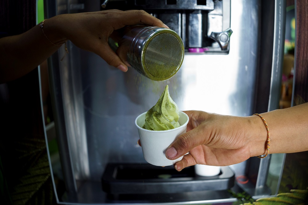 Cannabis mix powder is sprinkled on cannabis ice cream during the ‘360 Cannabis & Hemp for the People’ expo in Buriram province, Thailand March 5, 2021. — Reuters pic
