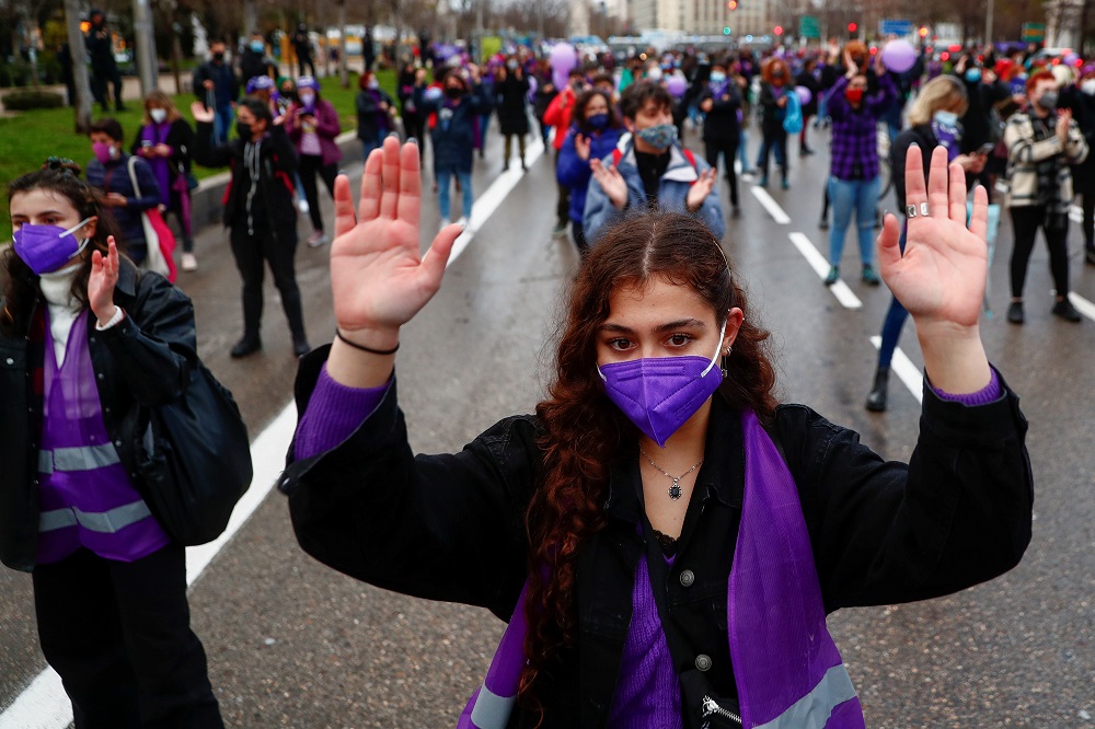File picture shows people taking part in a demonstration to mark International Women's Day, despite of being banned by local authorities, in Madrid March 8, 2021. — Reuters pic