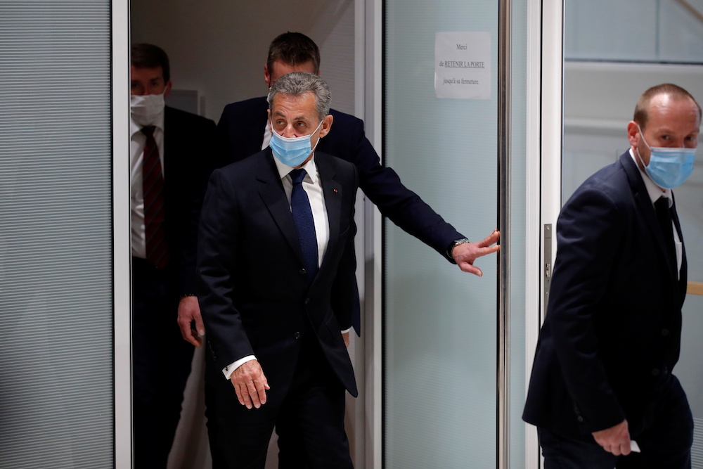 Former French President Nicolas Sarkozy, wearing a protective face mask, leaves after the verdict in his trial on charges of corruption and influence peddling, at Paris courthouse, France, March 1, 2021. u00e2u20acu201d Reuters pic